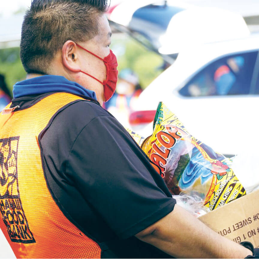 person carrying a box of food