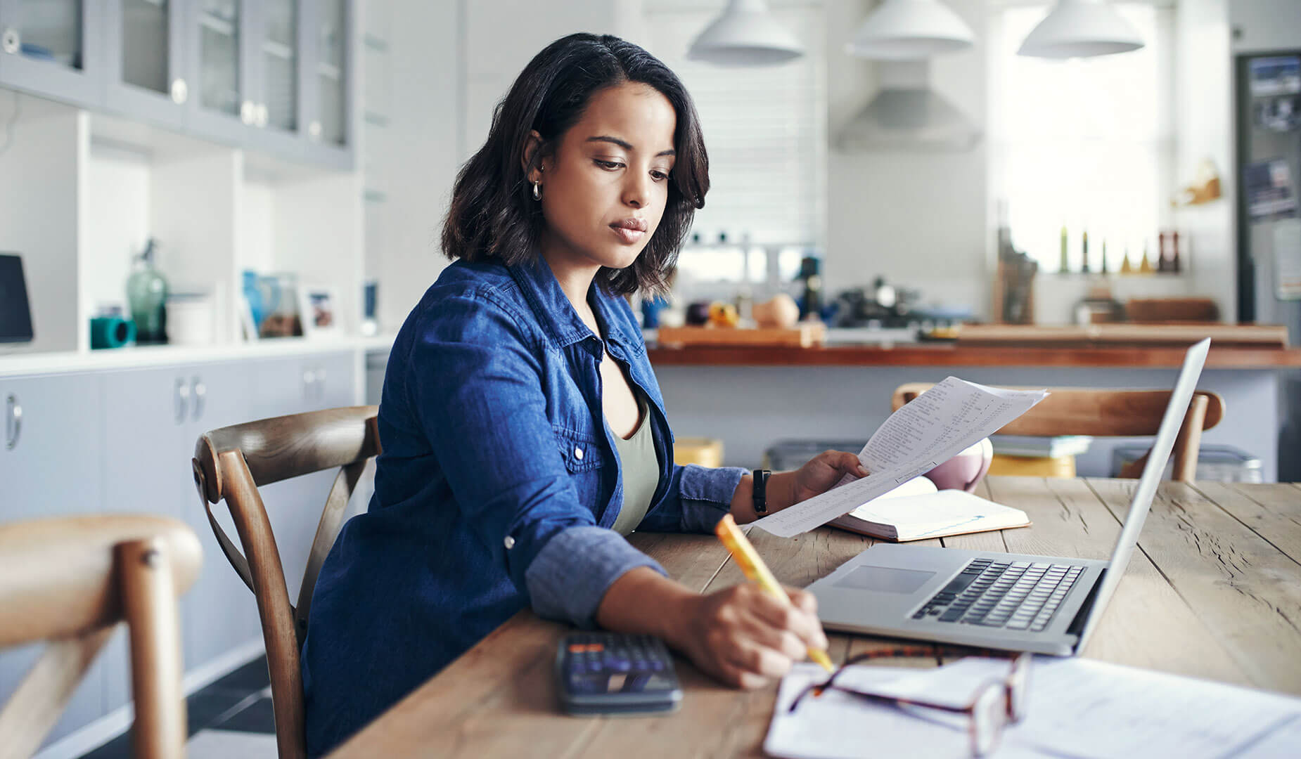 woman looking at paper documents