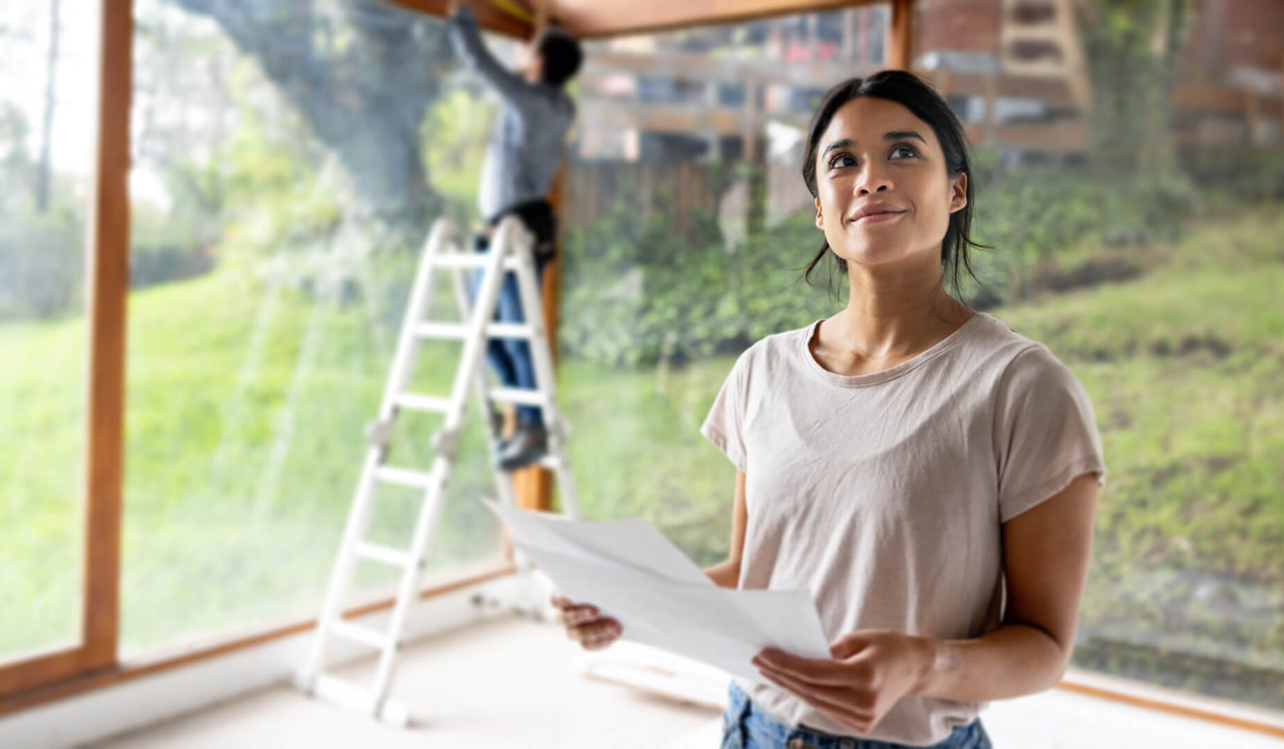 woman holding construction plans