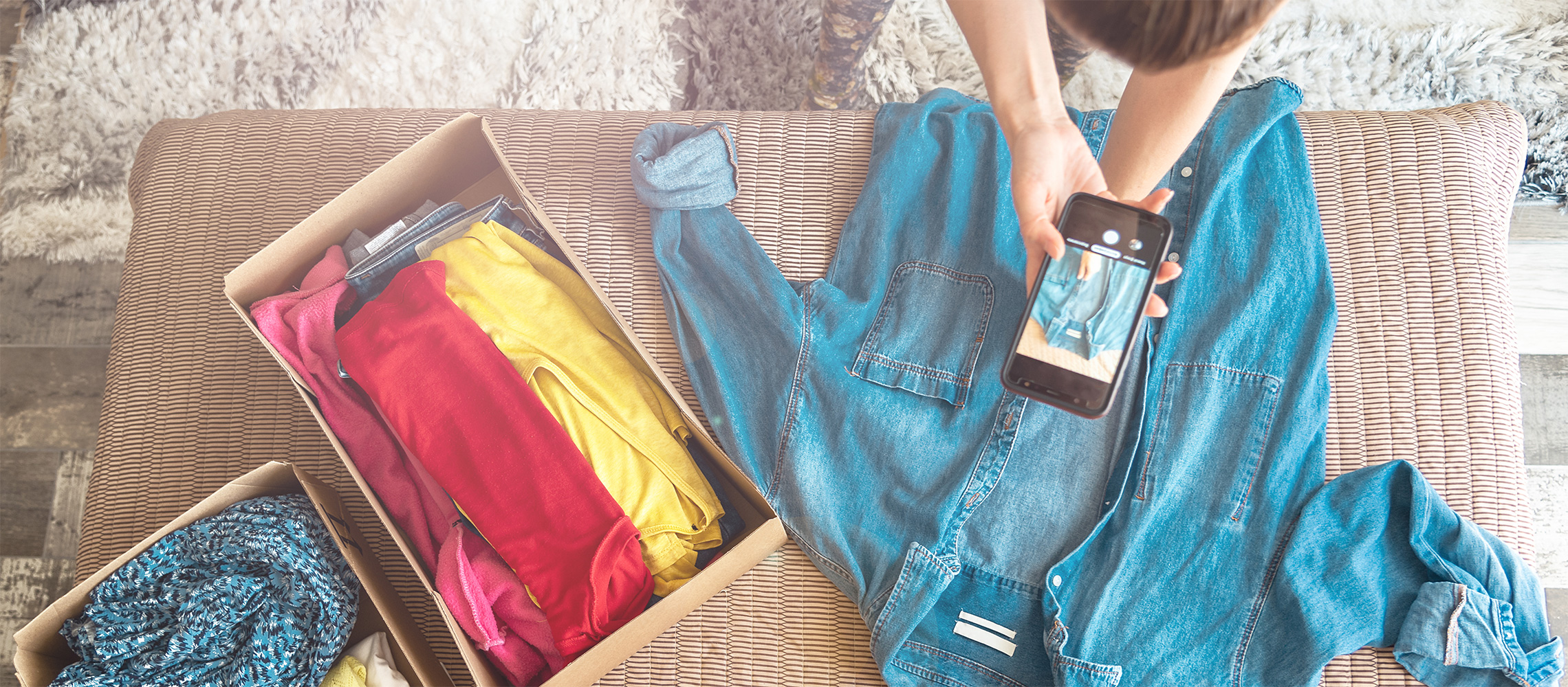 woman taking photo of clothes