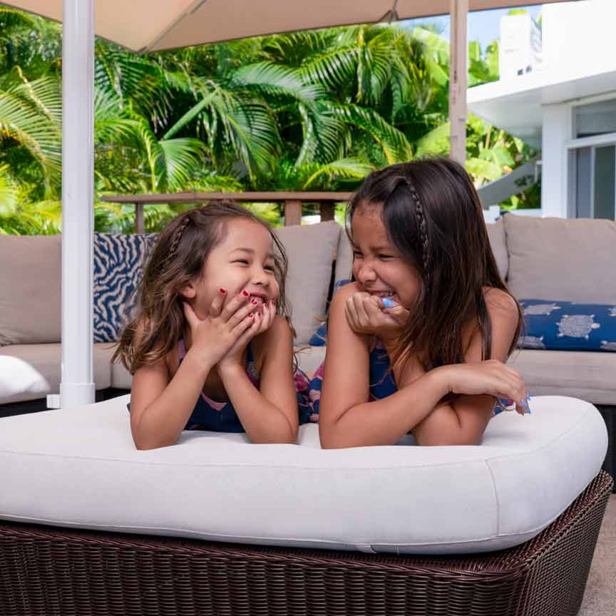 two young girls laughing